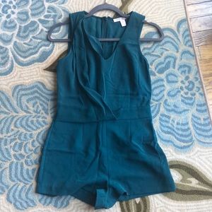 Dark green romper with zipper in back. Brand new condition.